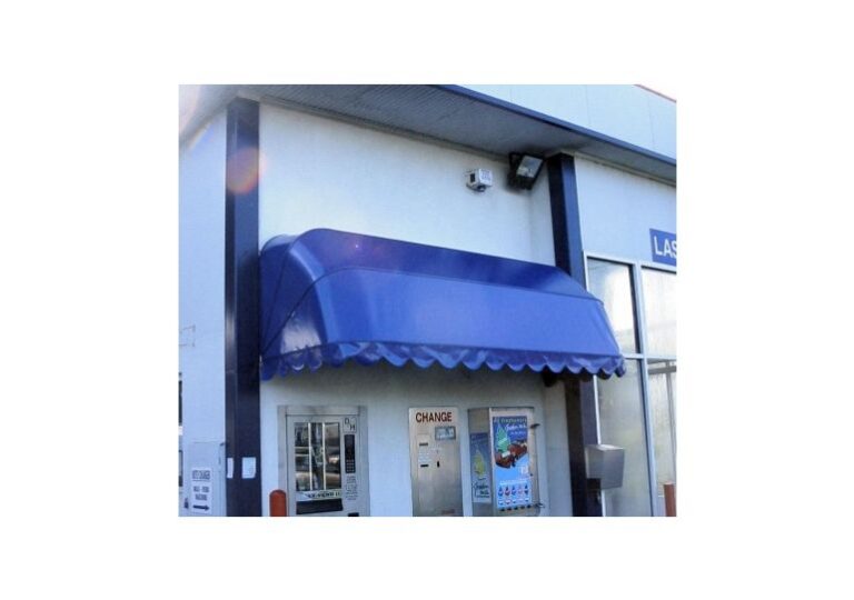 Blue dutch hood awning installed over a commercial shopfront entrance for sun protection and weather cover in Melbourne.